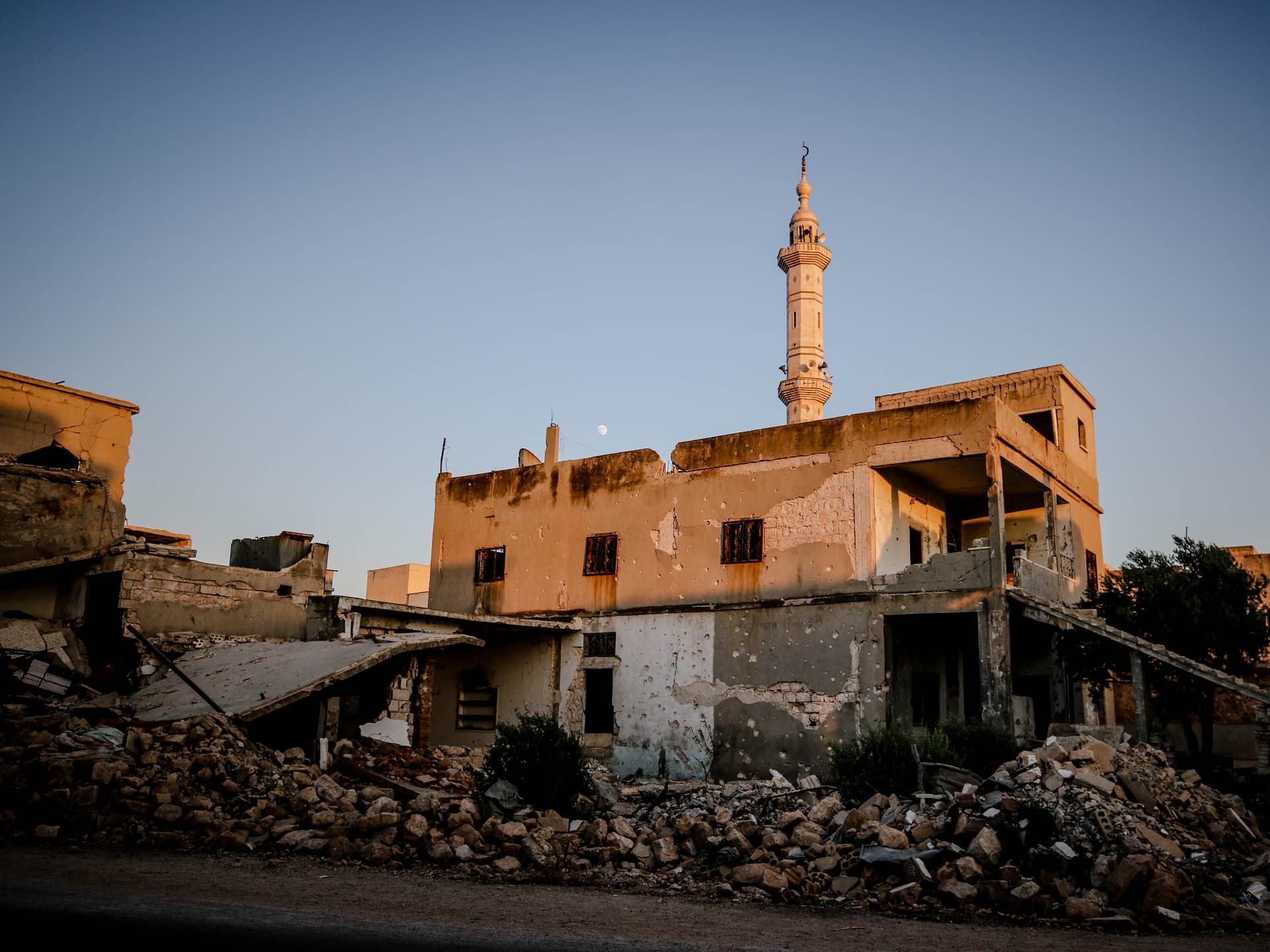 The sun shining on a destroyed building in Idlib, Syria.