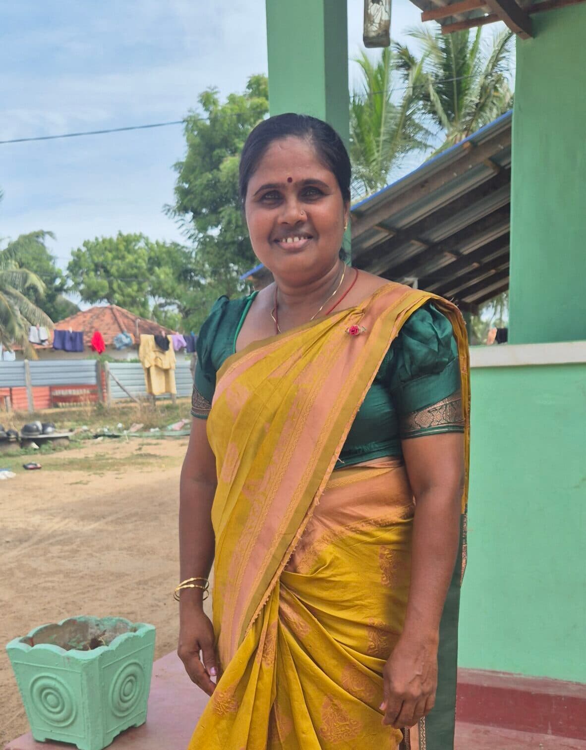 A portrait of South Asian woman smiling