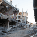 Severely damaged houses and rubble.