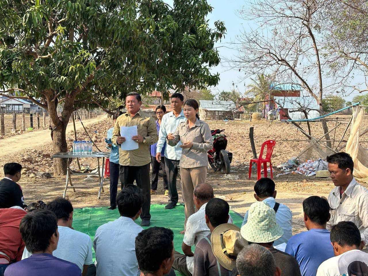 Photo: Diakonia A group of people standing outside with a tree in the background.