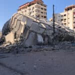 A collapsed building in the middle of the city.