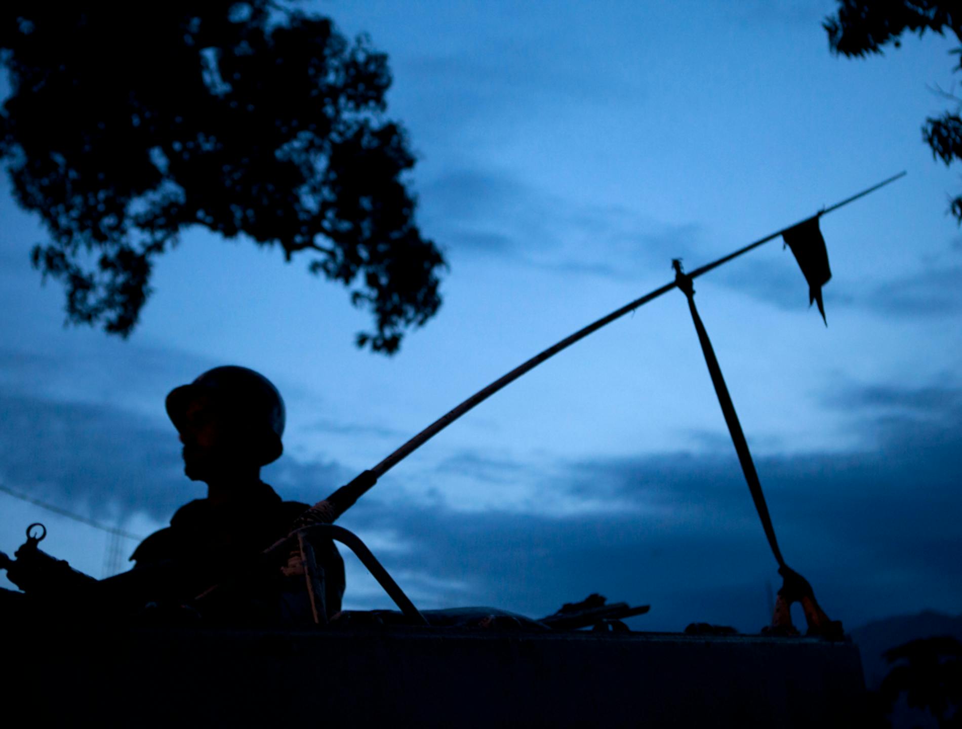 The silhouette of a soldier patrolling at night. Photo: MONUSCO/Sylvain Liechti