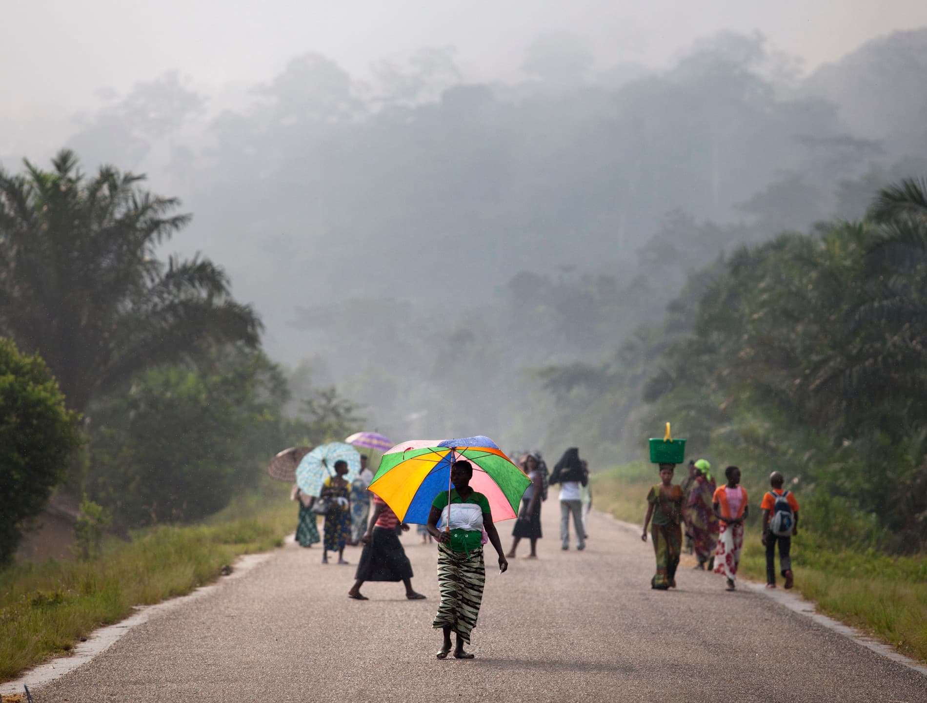 A group of people walking on the street in Eastern Congo.