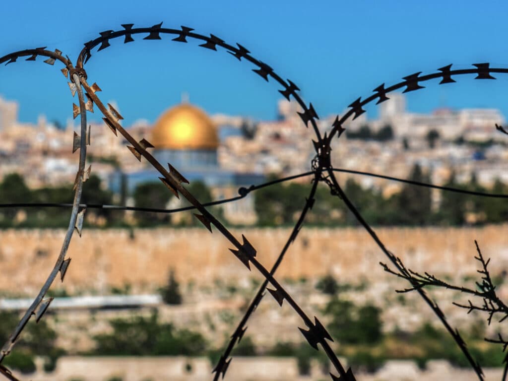 Barbed wire and in the background the Temple Mountain.