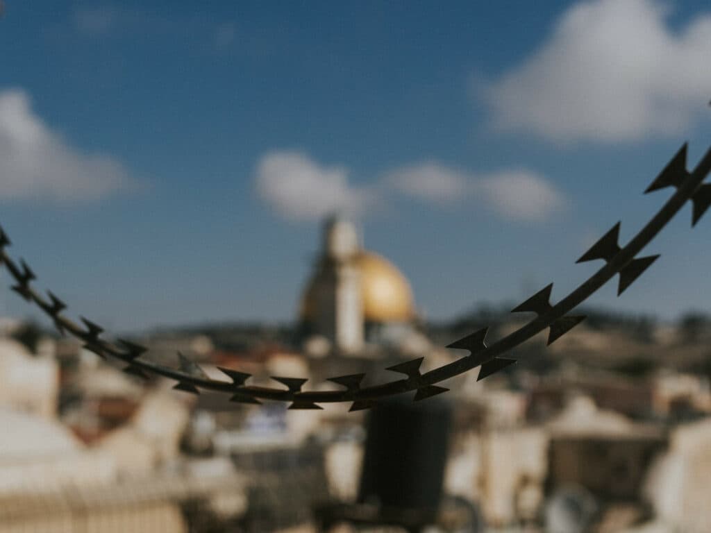 Barbed wire and in the background the Temple Mountain.