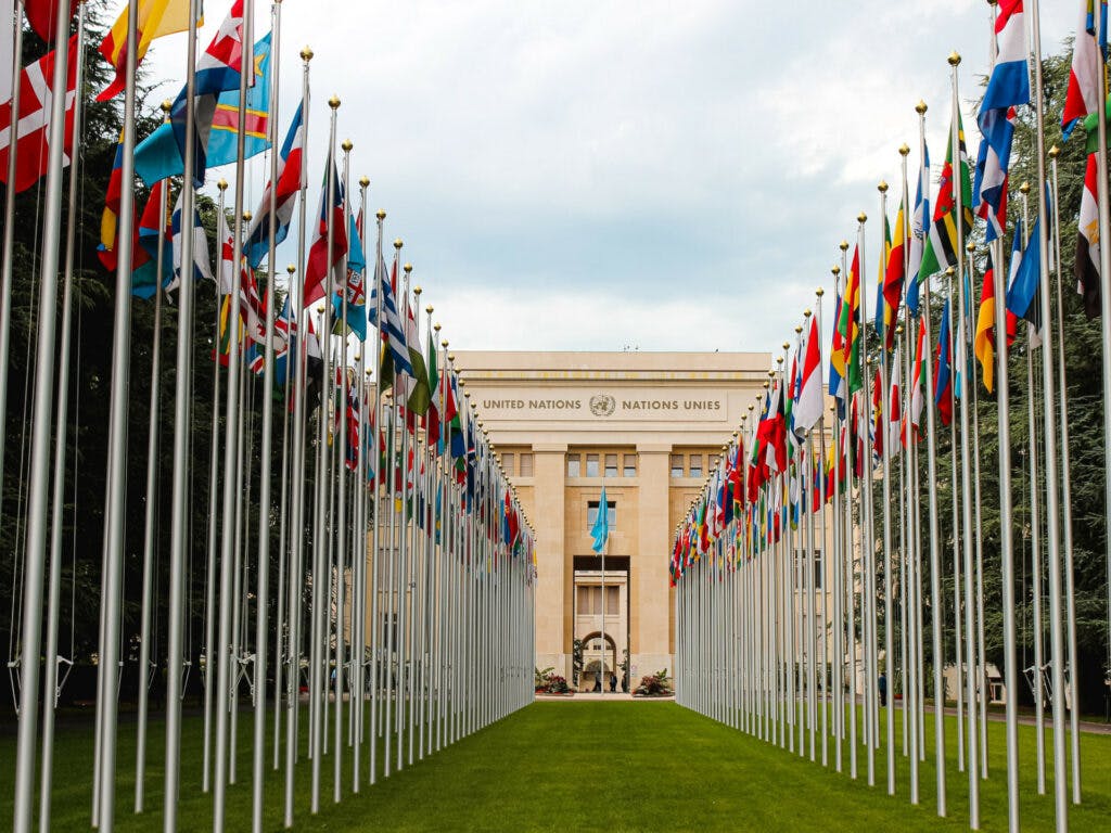 Flags in front of a United Nations building in Geneva.