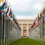 Flags in front of a United Nations building in Geneva.