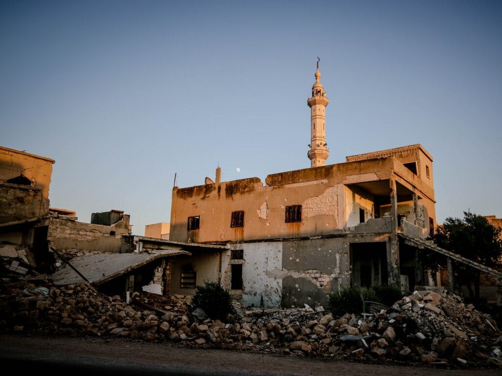 The sun shining on a destroyed building in Idlib, Syria.