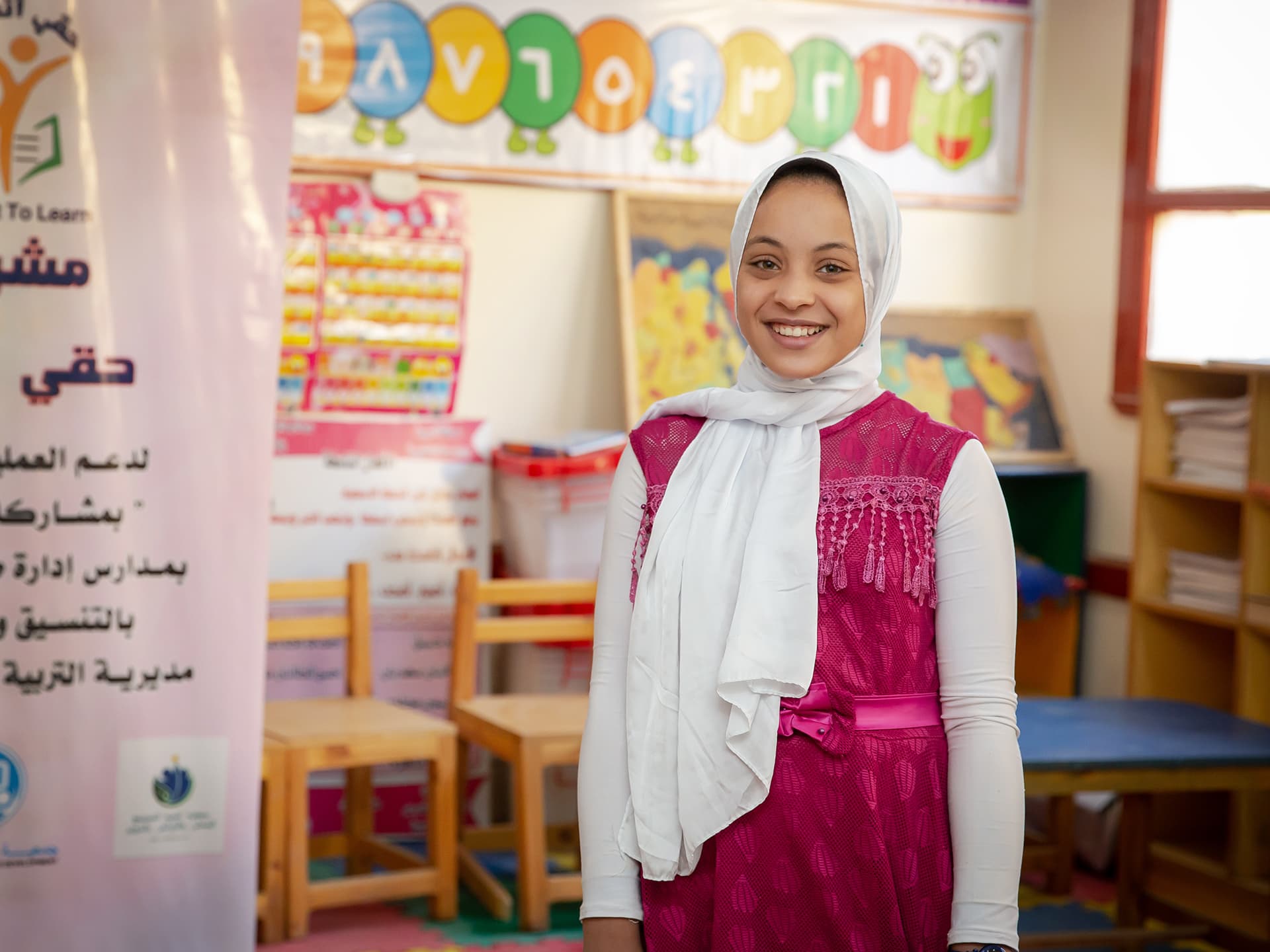 A girl in a classroom.