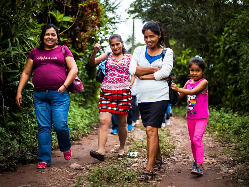 Women walking in tropical forest