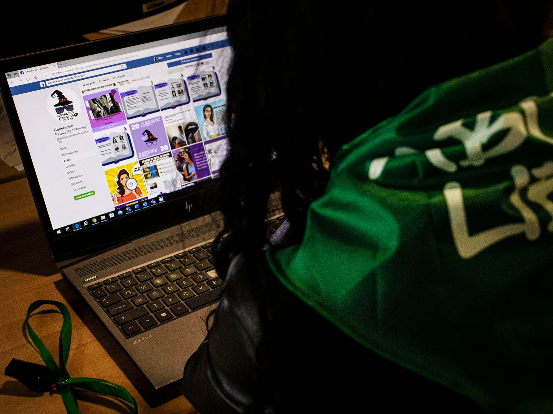 A woman sitting in front of computer screen