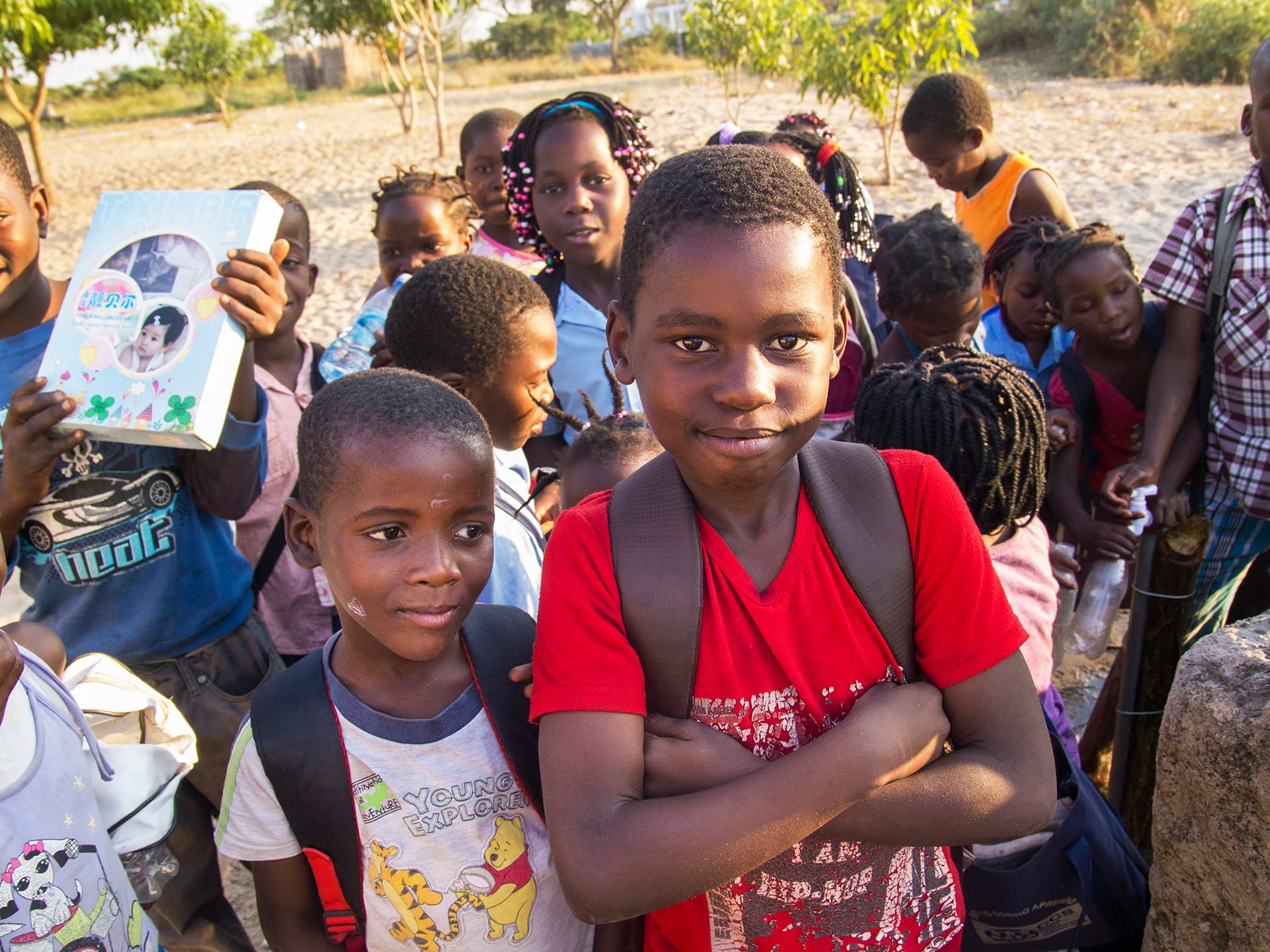 A group of school children looking in to the camera.