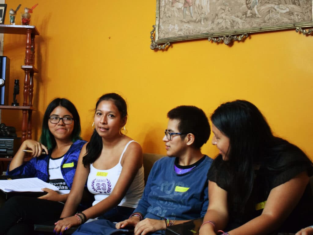 Young people sitting in a couch Peru