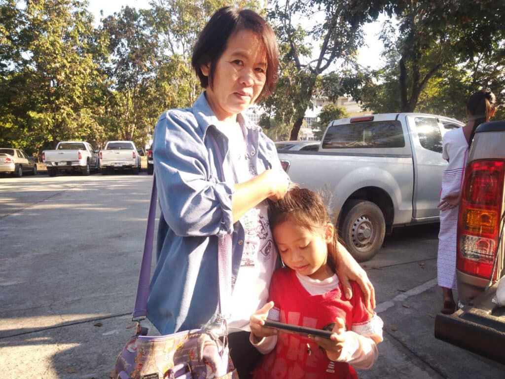 Photo: P-Move A woman standing with a child.